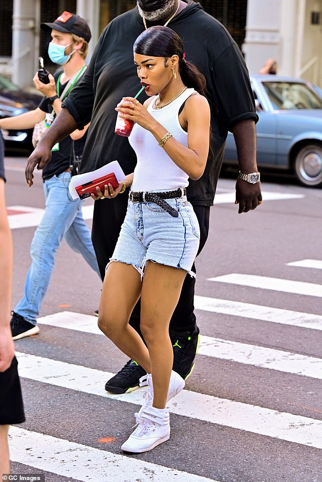 Teyana Taylor shows off her toned legs in denim shorts on the set of A