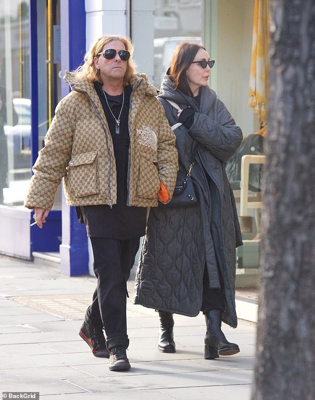Former Page 3 girl Kathy Lloyd, 54, steps out for a stroll with husband