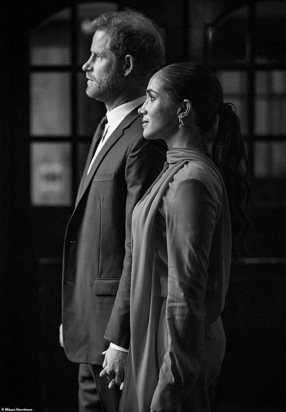 Meghan Markle poses like a CEO with Prince Harry at her side in new