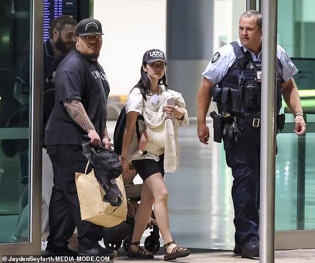 Post Malone touches down in Sydney with girlfriend and baby daughter