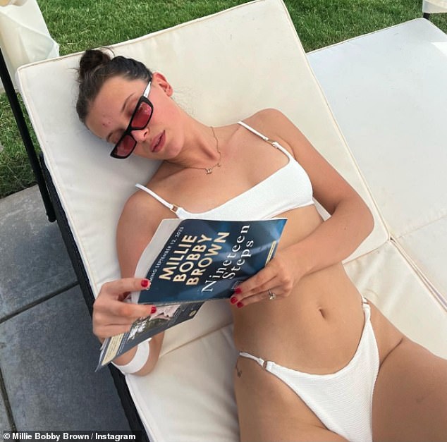 Millie Bobby Brown showcases her figure in a white bikini as