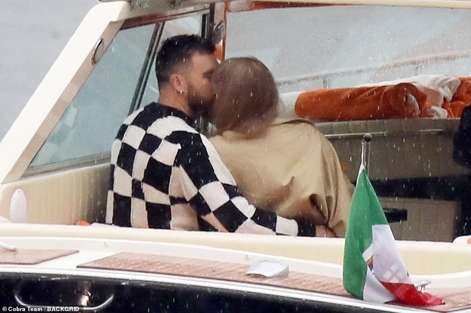 Taylor Swift and Travis Kelce are pictured kissing and embracing on
