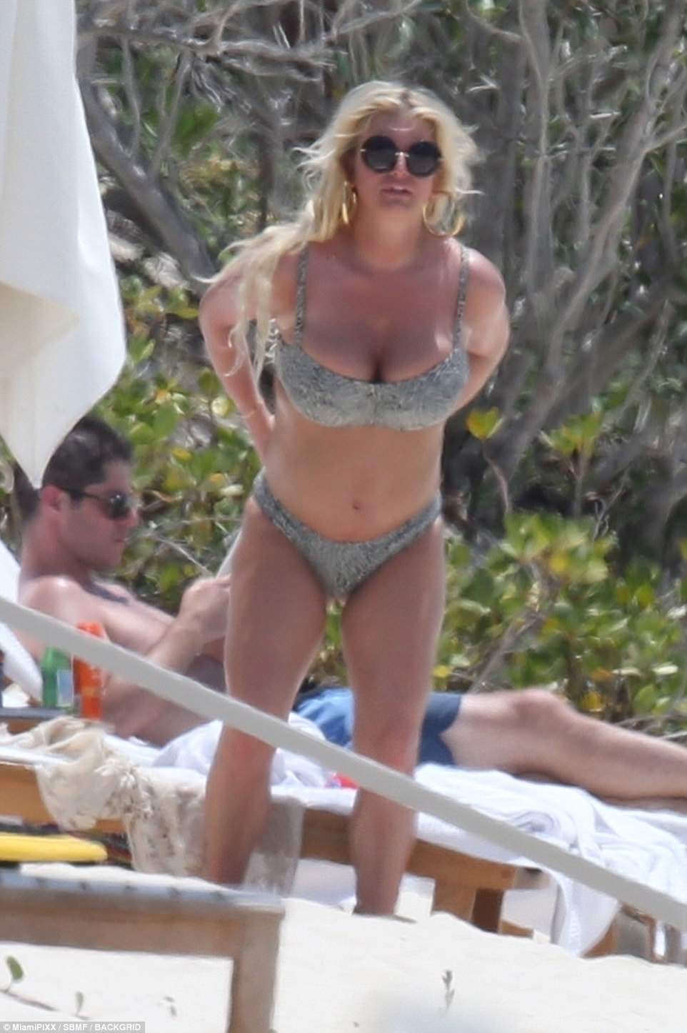 Jessica Simpson flaunts body in leopard print bikini on Bahamas getaway