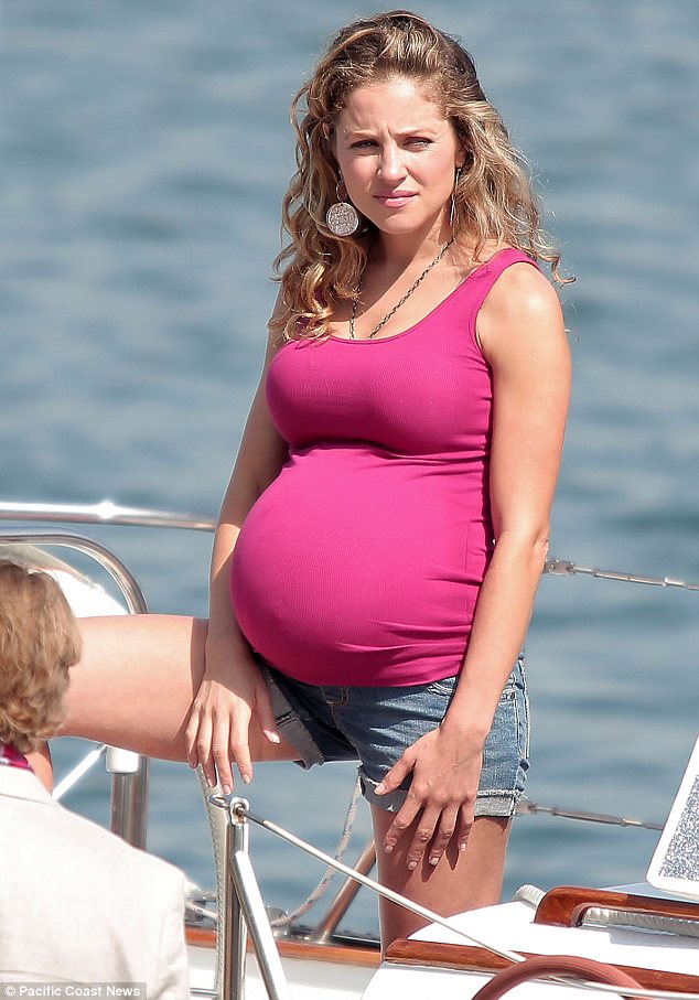 Revenge actress Margarita Levieva rubs fake bump as she films for