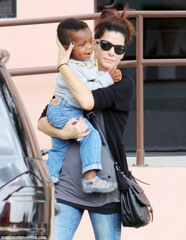 Sandra Bullock cradles son Louis as they enjoy stroll Daily Mail Online