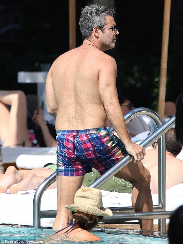 Andy Cohen, 44, plays it cool by the pool on wellearned break from