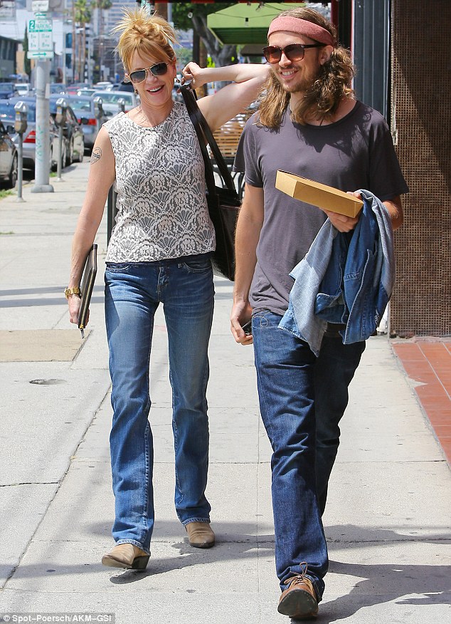 Melanie Griffith and longhaired son Alexander Bauer are all smiles