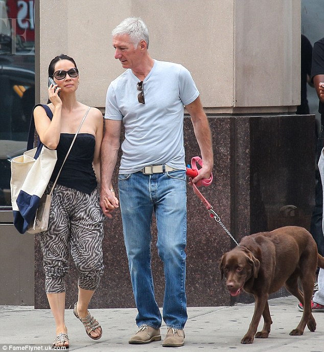 Lucy Liu strolls handinhand with mystery man as pair enjoy a spot of