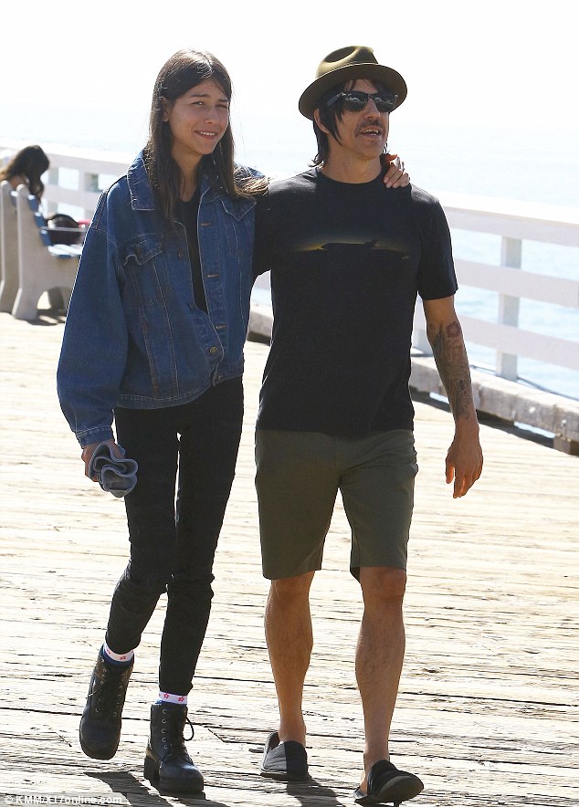 Anthony Kiedis and girlfriend Helena Vestergaard walk in each other's