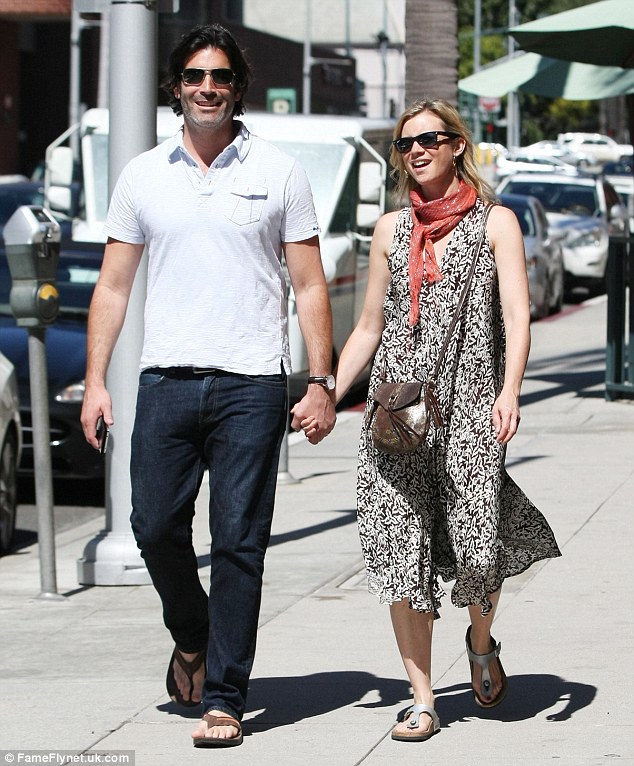 Amy Smart enjoys a handinhand stroll with husband Carter Oosterhouse