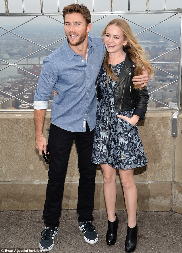Scott Eastwood cuddles up to Britt Robertson as they promote The
