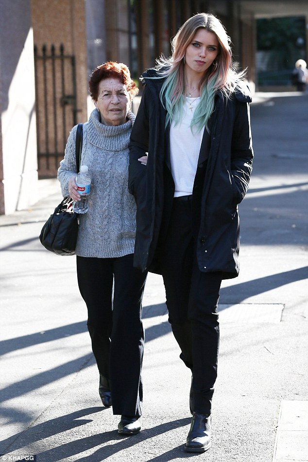 Abbey Lee Kershaw holds hands with an elderly women in Sydney Daily