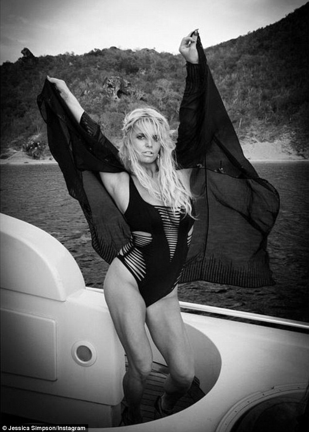 Jessica Simpson slips into same black bathing suit Kylie Jenner modeled