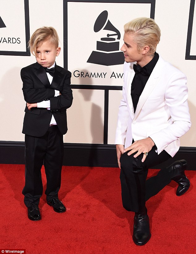 Justin Bieber kisses halfbrother Jaxon's cheek on Grammy Awards red