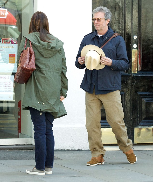 Eric Clapton, 70, and his wife of fifteen years Melia, 39, dress down