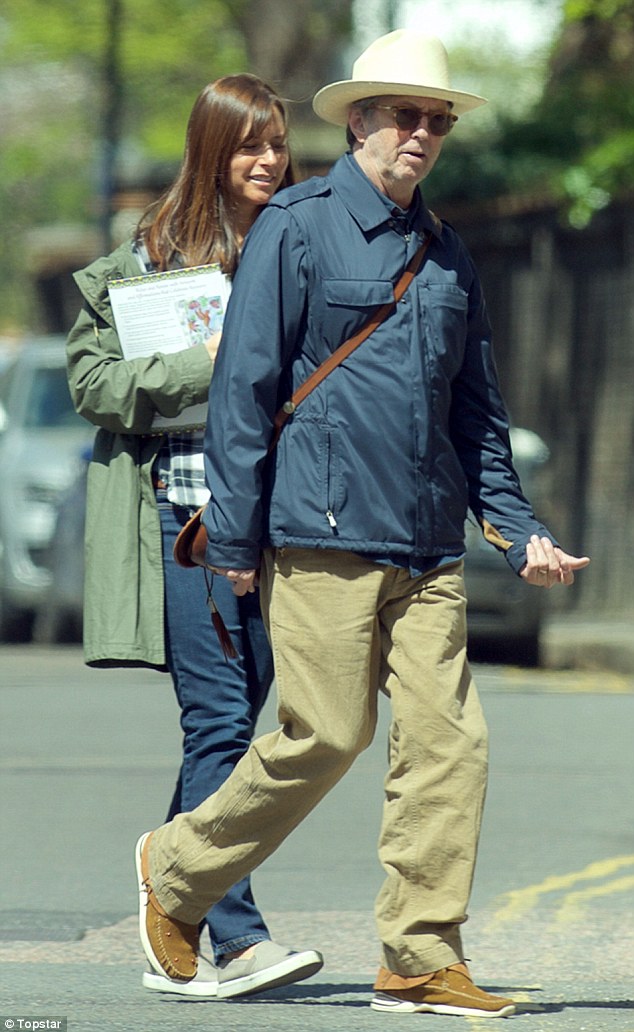 Eric Clapton, 70, and his wife of fifteen years Melia, 39, dress down