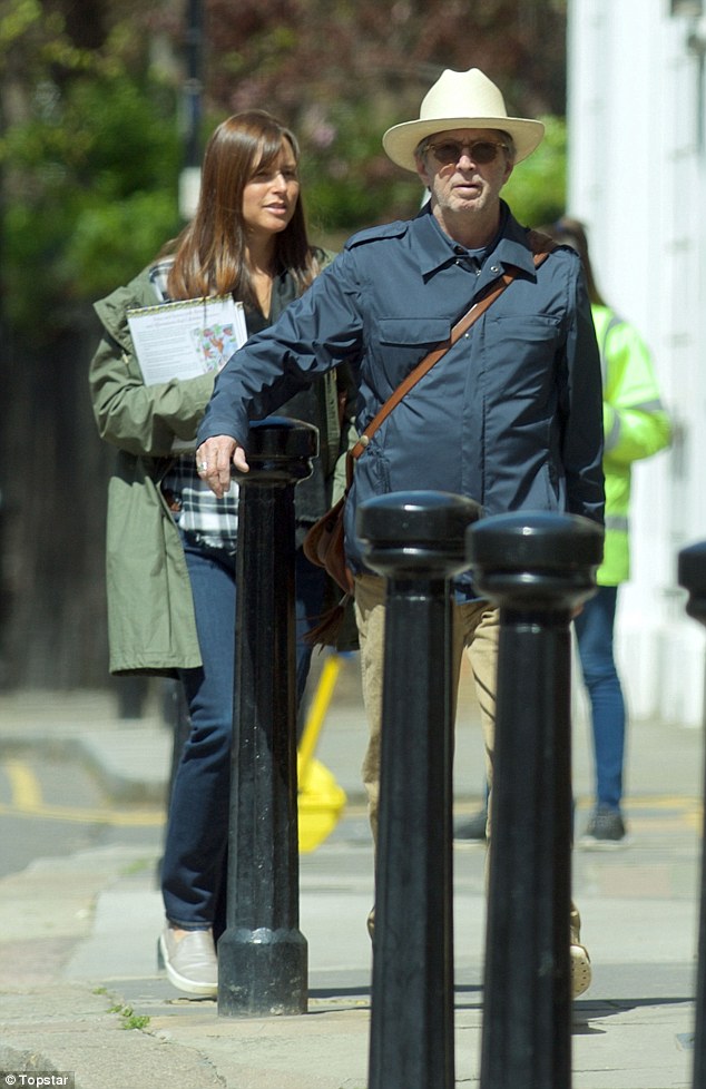 Eric Clapton, 70, and his wife of fifteen years Melia, 39, dress down