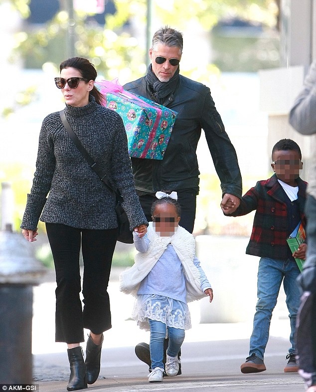 Sandra Bullock and beau Bryan Randall take her kids to a birthday party