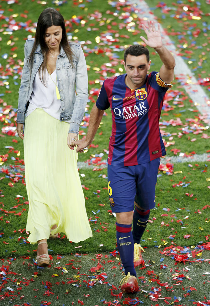 PHOTOS Cheers and tears as champions Barca give Xavi emotional send