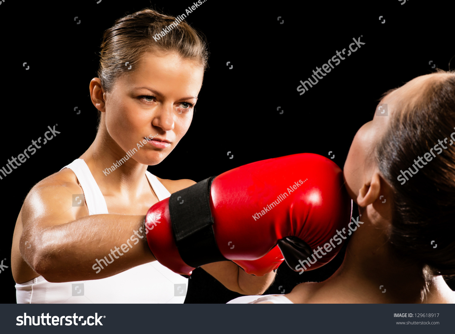 Aggressive Boxing Woman, Hits An Opponent In The Head Stock Photo