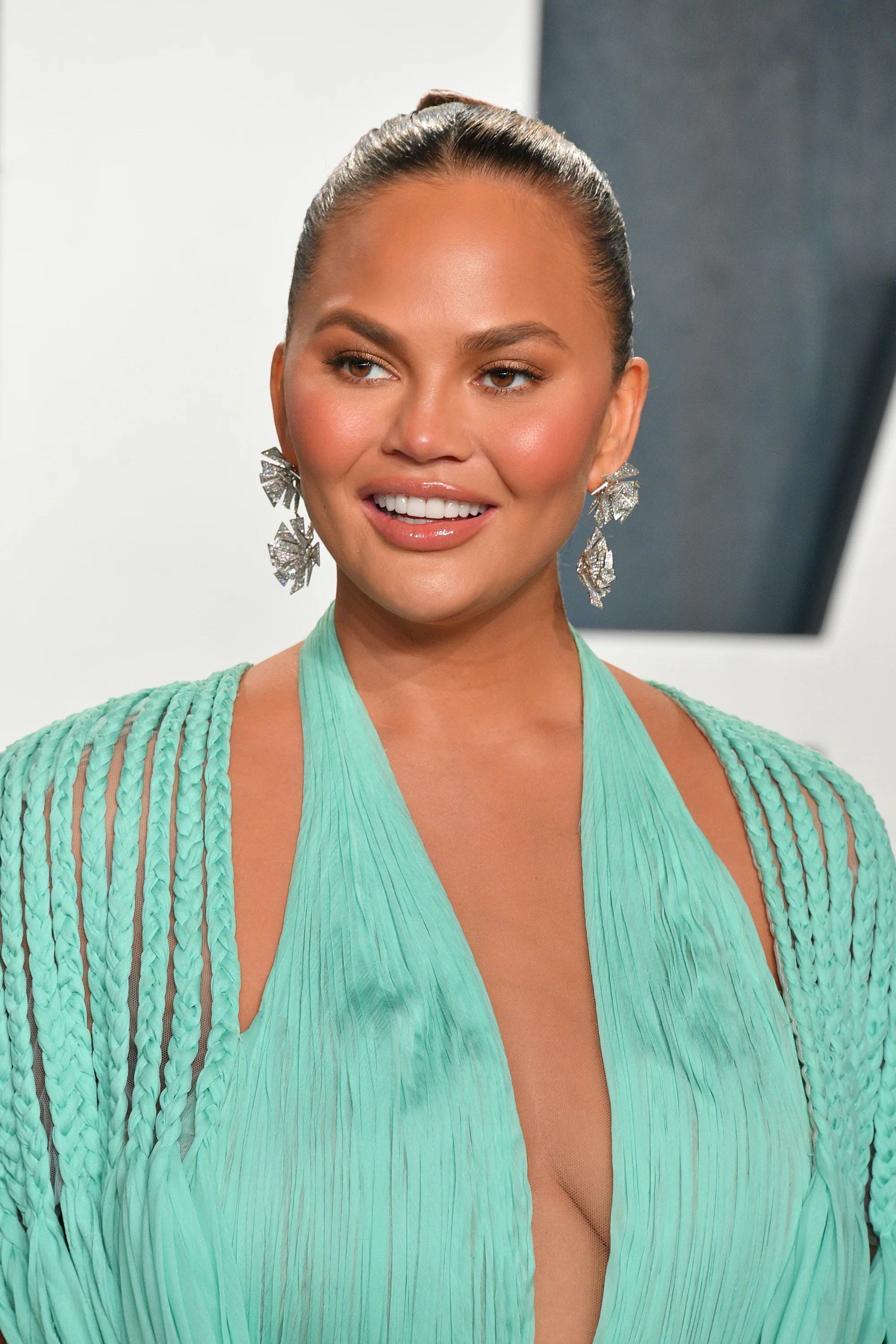 Chrissy Teigen's 'Deal Or No Deal' Throwback Photo Is Peak 2000s