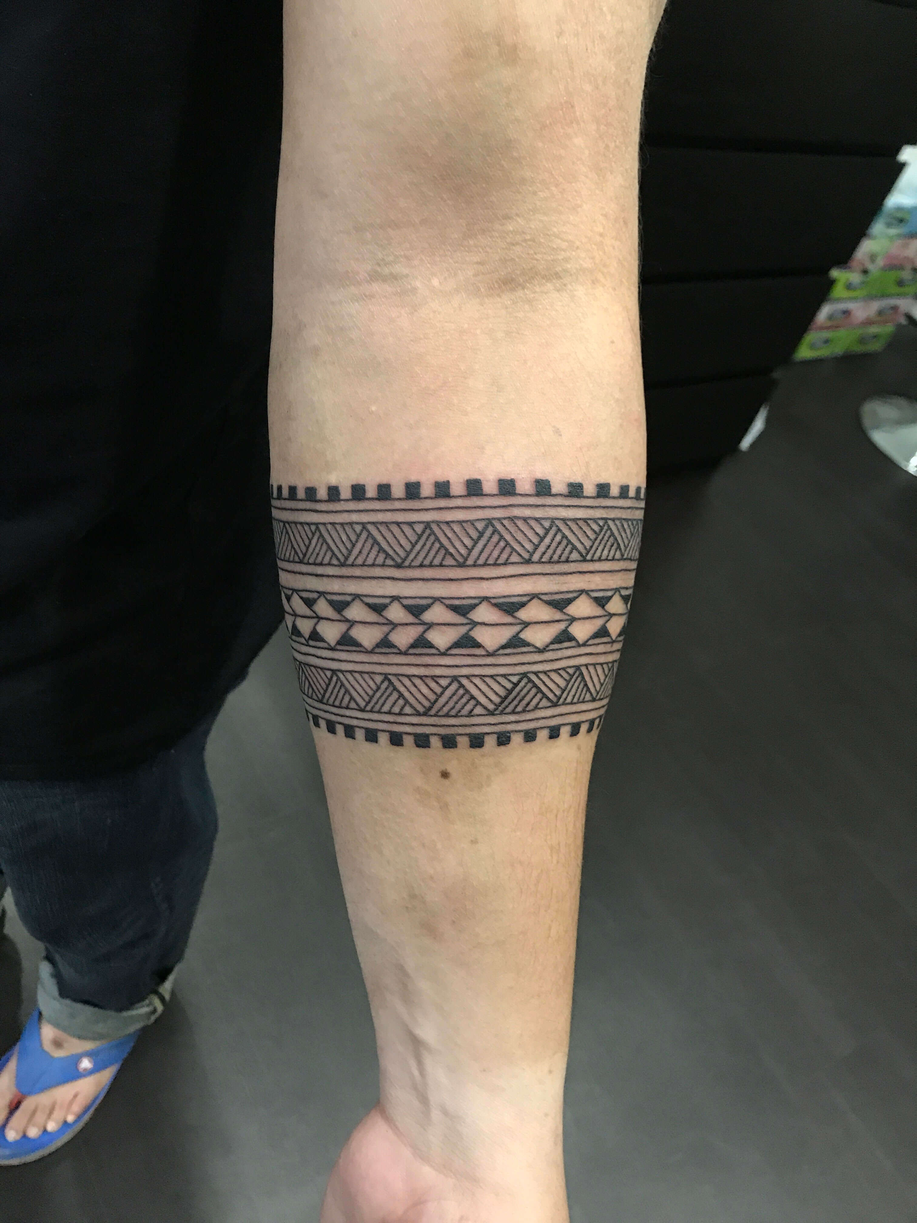 Captivating Tattoo Designs: Tribal Arm Art ·