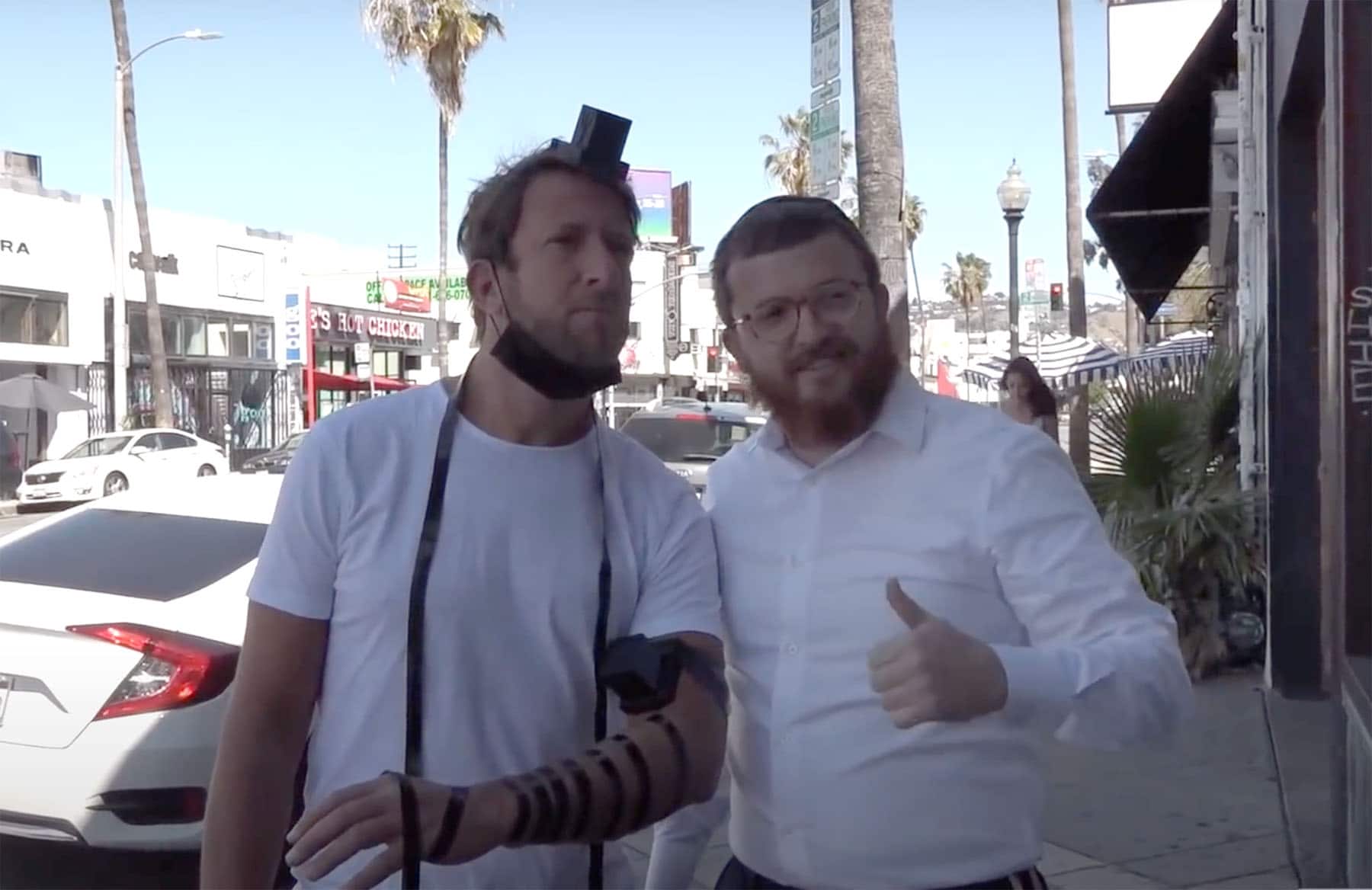 Local Rabbi Introduces Social Media Star David Portnoy to Tefillin