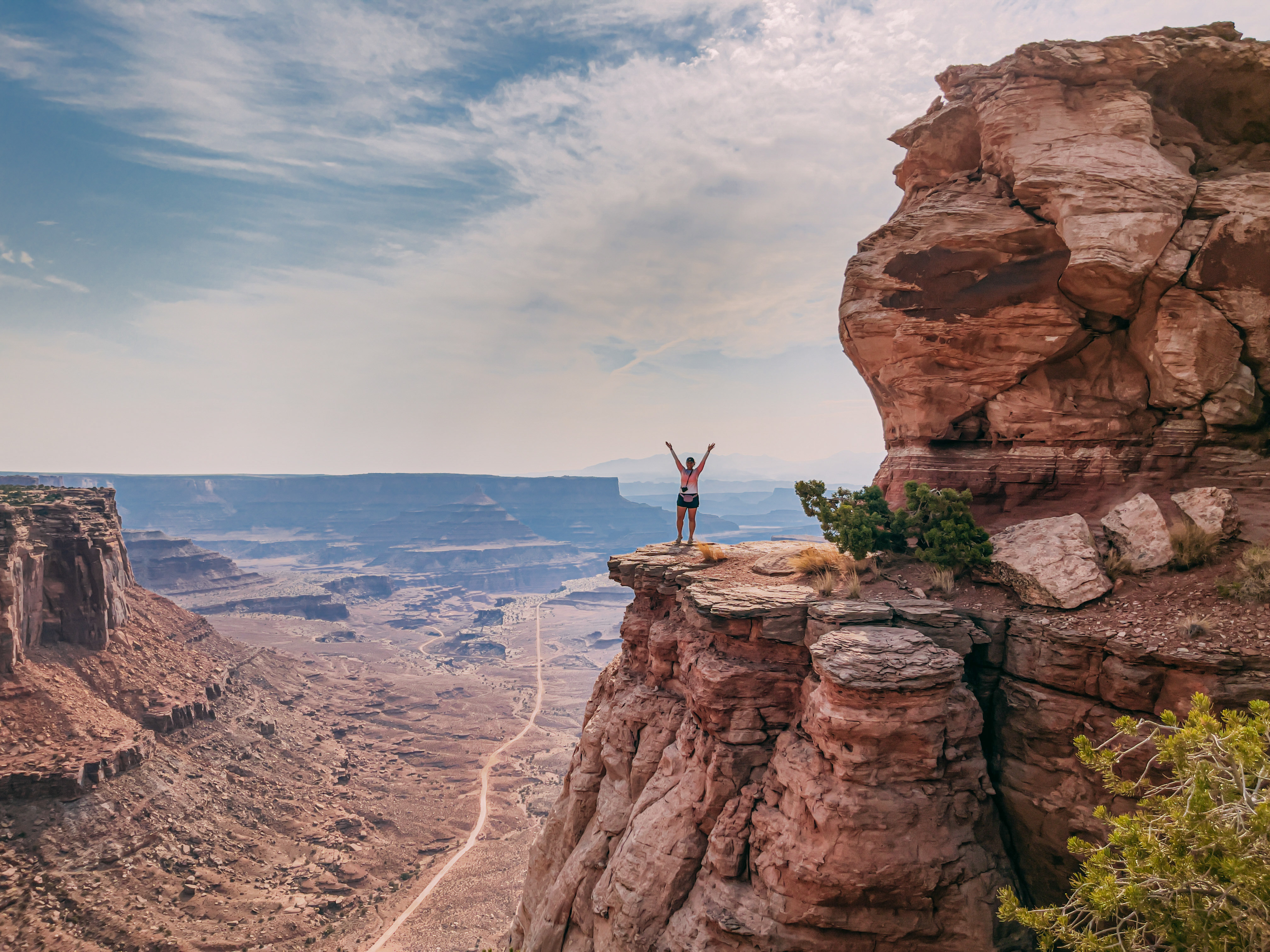 standing at the top of shafer canyon in island in the sky