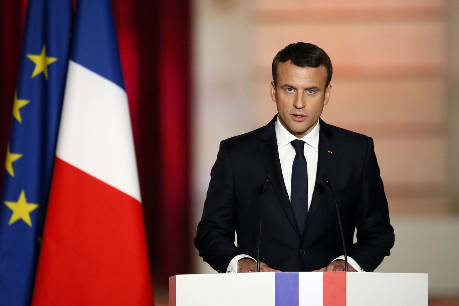 President of France is slapped in the face by demonstrators