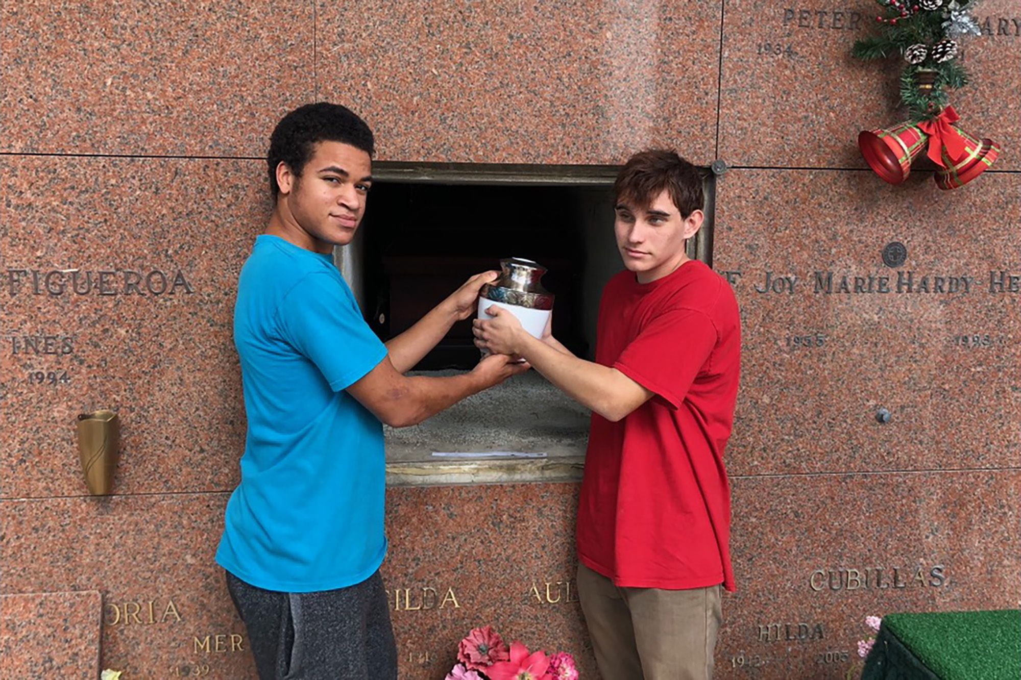 Photo shows accused Florida gunman, his brother holding mom’s ashes