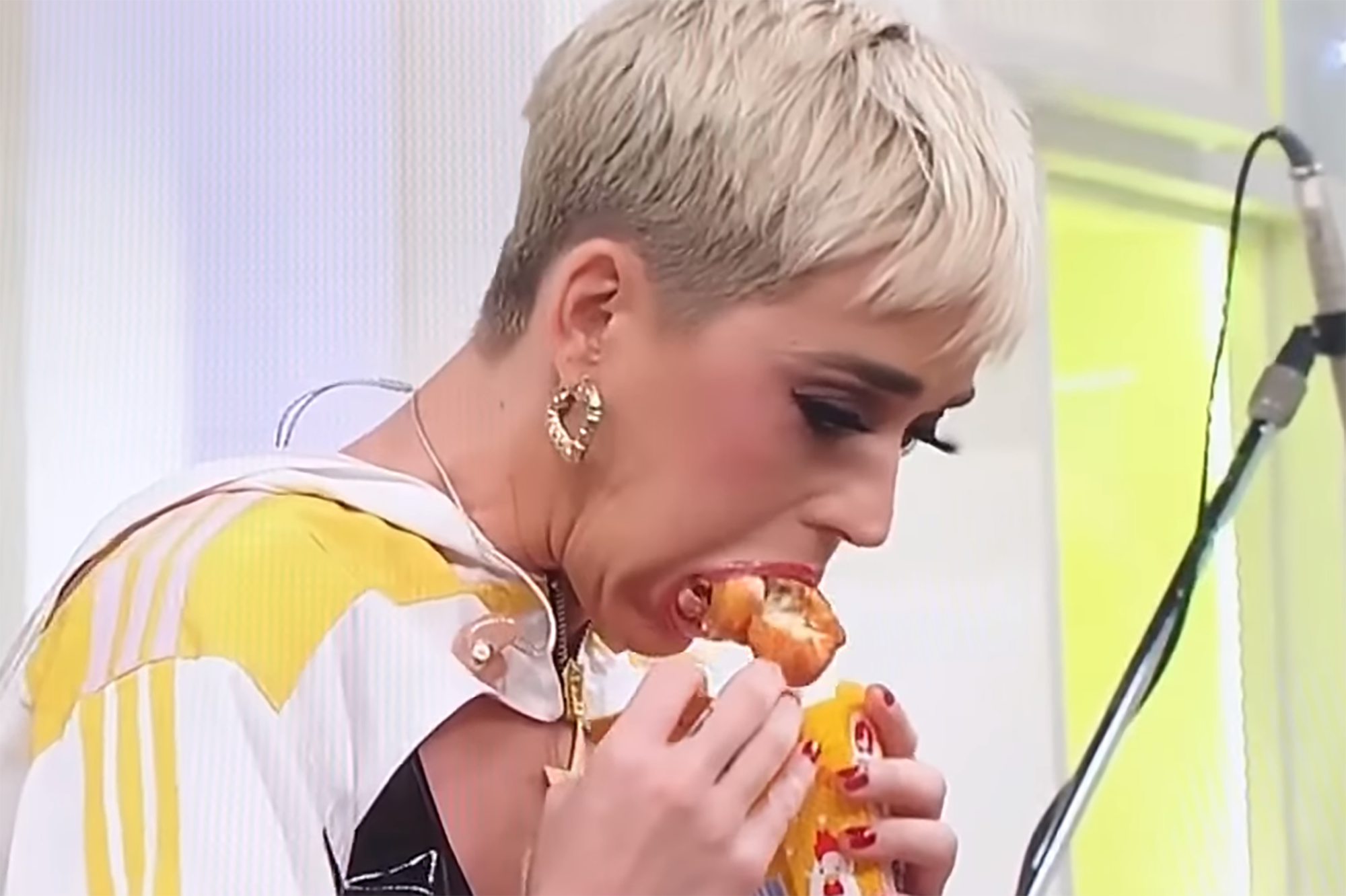 Katy Perry stuffs face full of chicken, is forced to spew on TV show