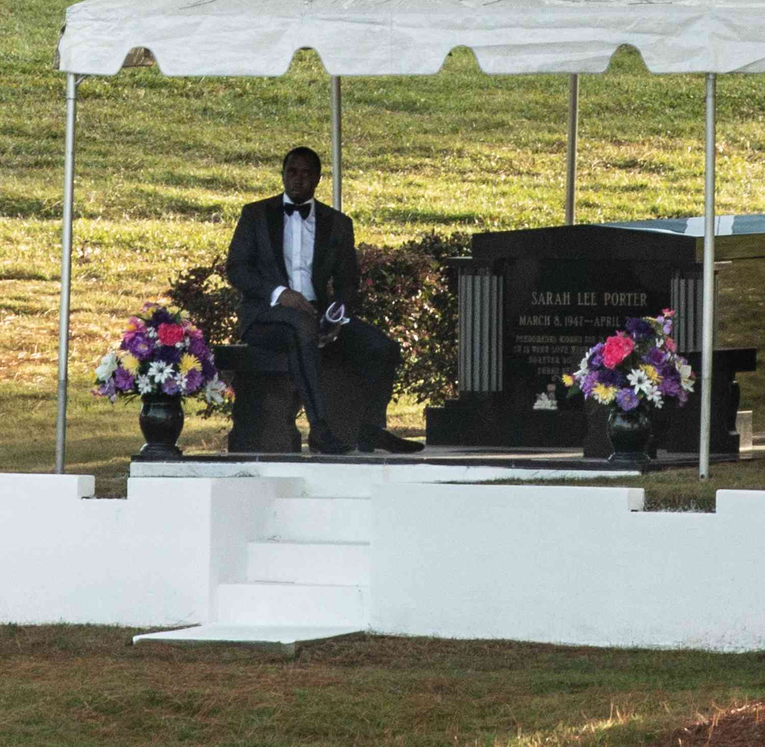 Sean 'Diddy' Combs Sits by Kim Porter's Gravesite