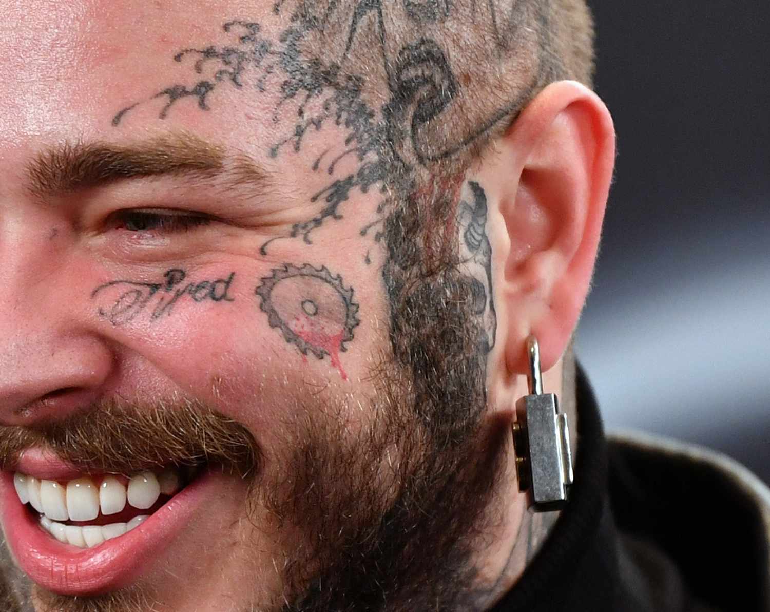 A Guide to Post Malone's Tattoos and What They Mean