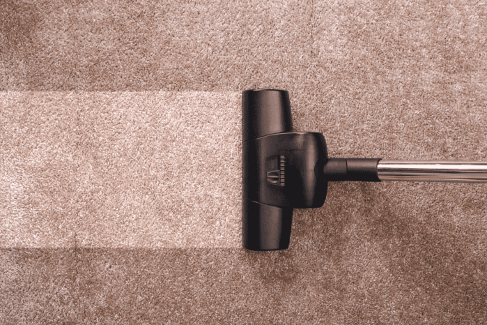 Vacuuming carpet Vacuuming carpet