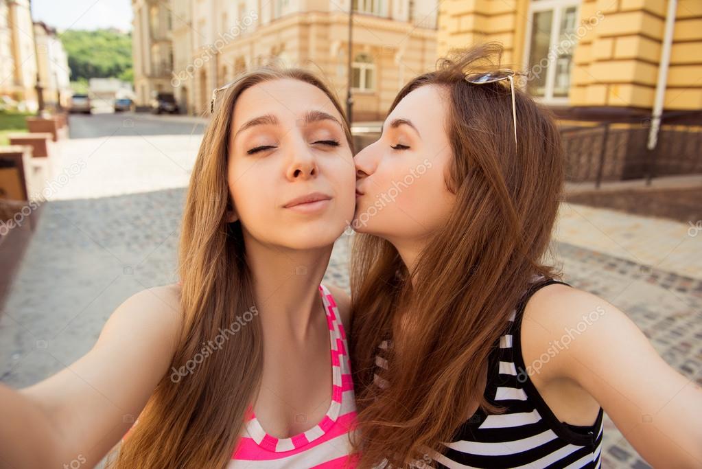 Cute girl kissing her pretty girlfriend Stock Photo by ©deagreez1 86054406