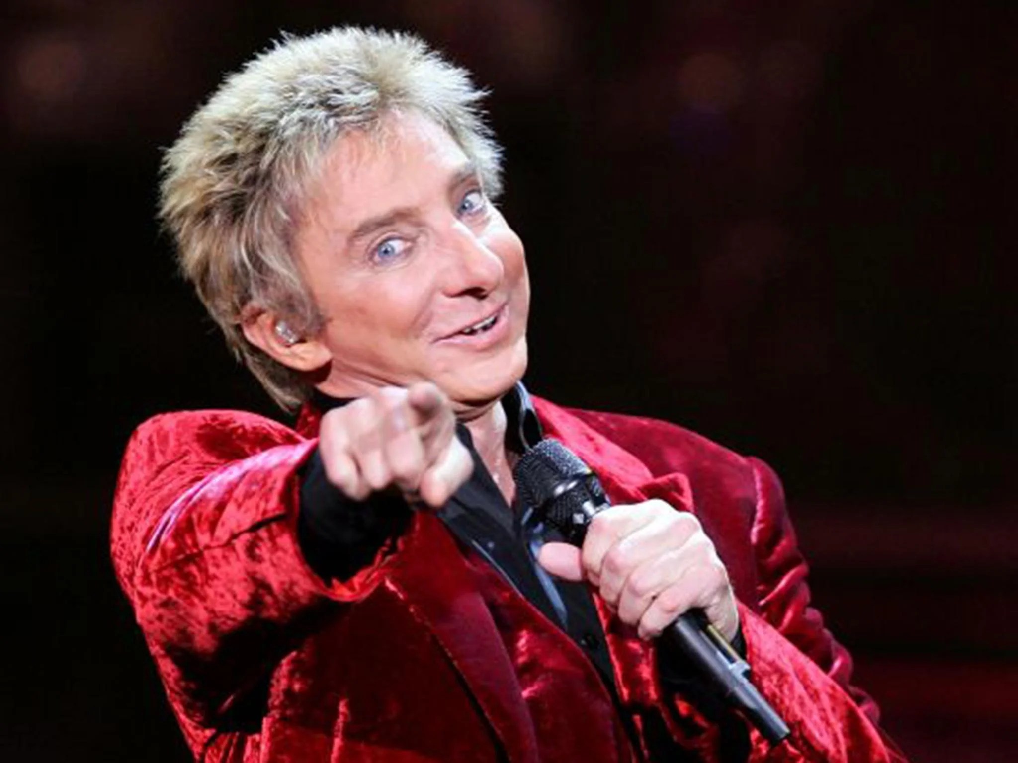 Barry Manilow 'out of surgery and doing well' but ordered not to 'talk