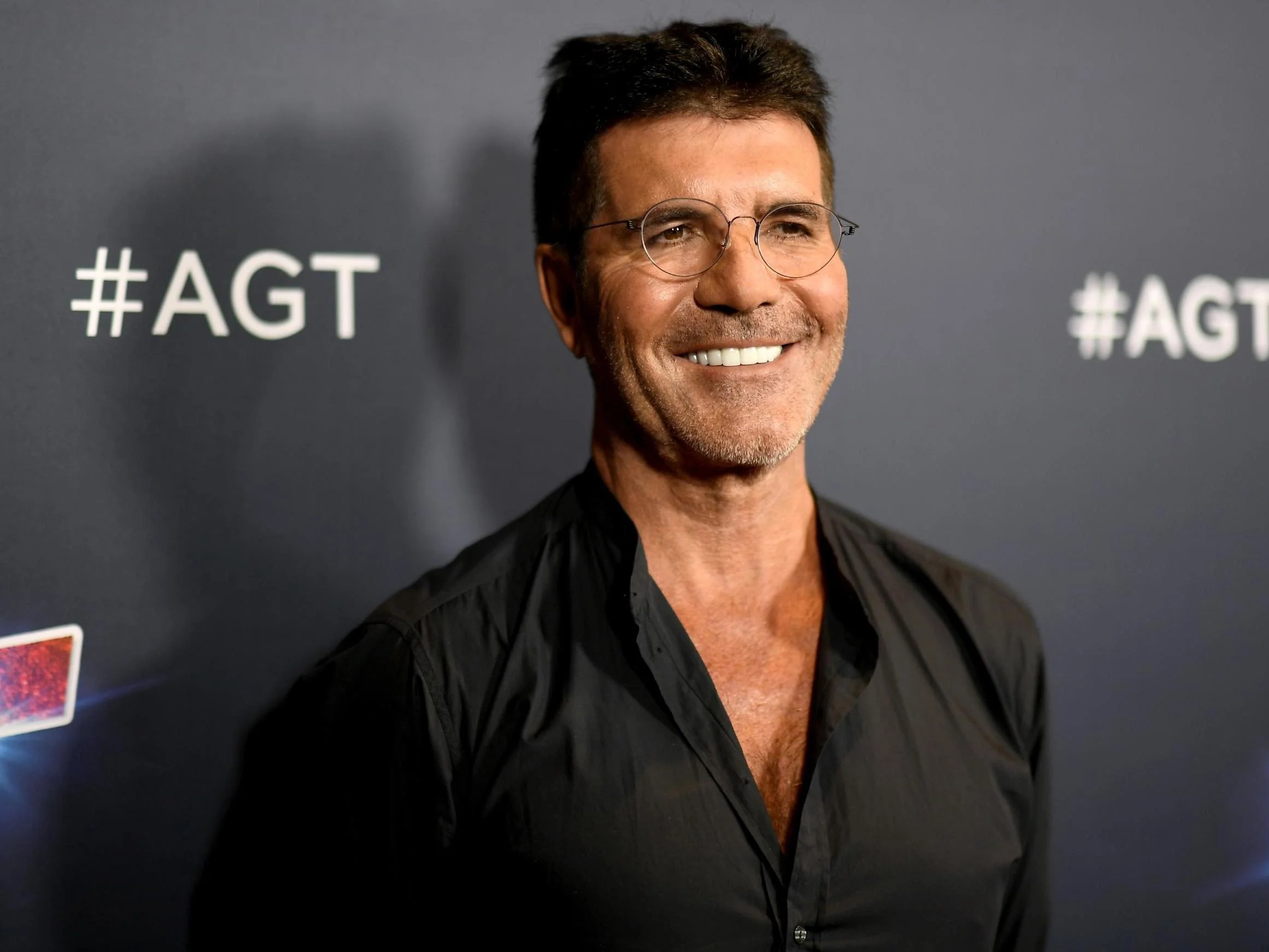 Simon Cowell 'doing spectacularly well' after breaking back, Howie Mandel says The Independent