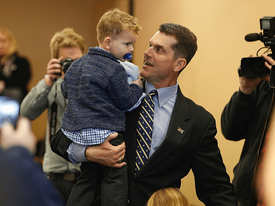 Jim Harbaugh coaches his kids on how to hustle and win Halloween