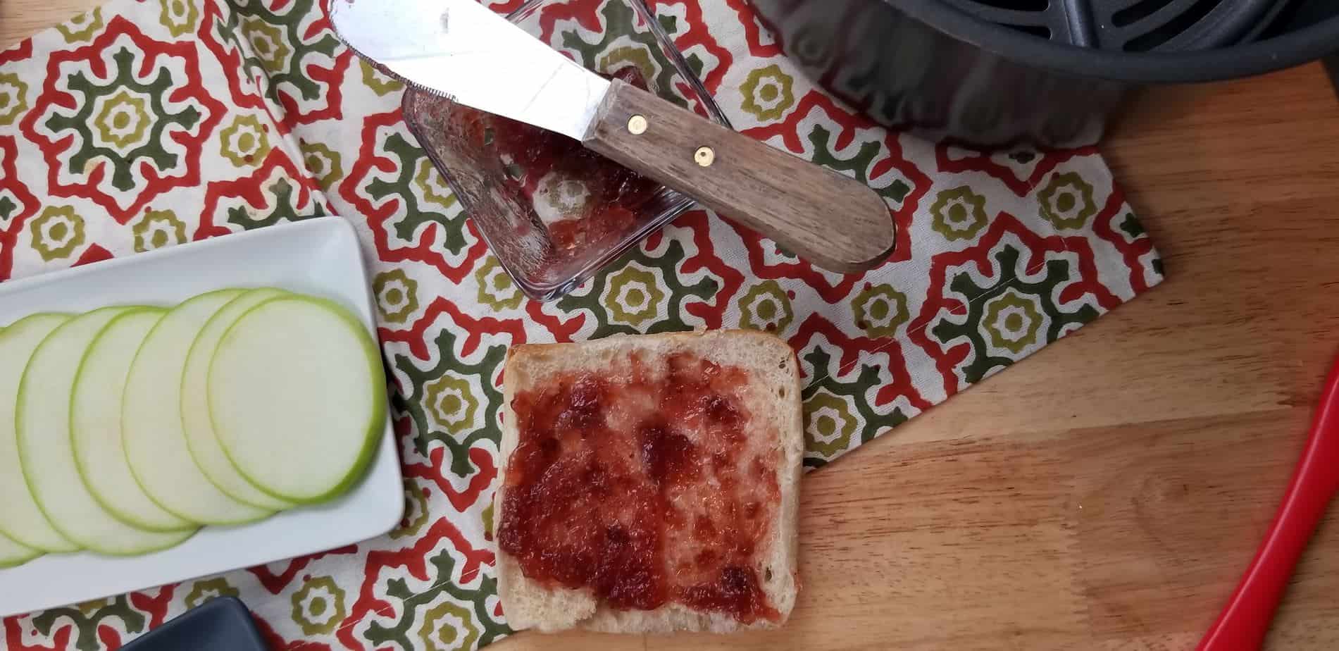 Next add jam and apples to the bread for the best grilled cheese sandwich