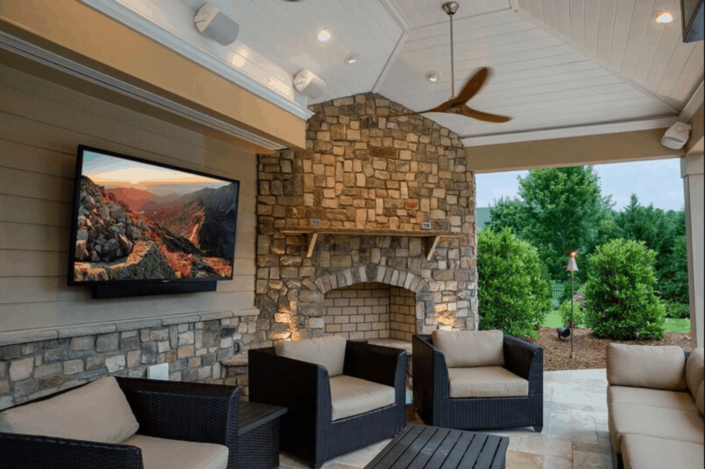 A SunBrite TV outside on a gorgeously decorated patio.