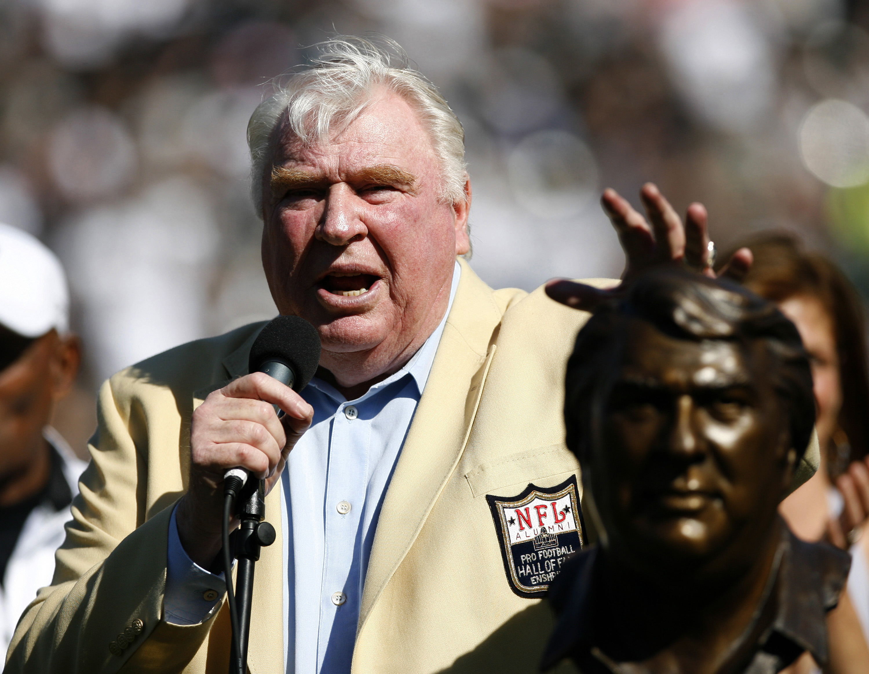 John Madden taps his bust during his Hall of Fame Ceremony
