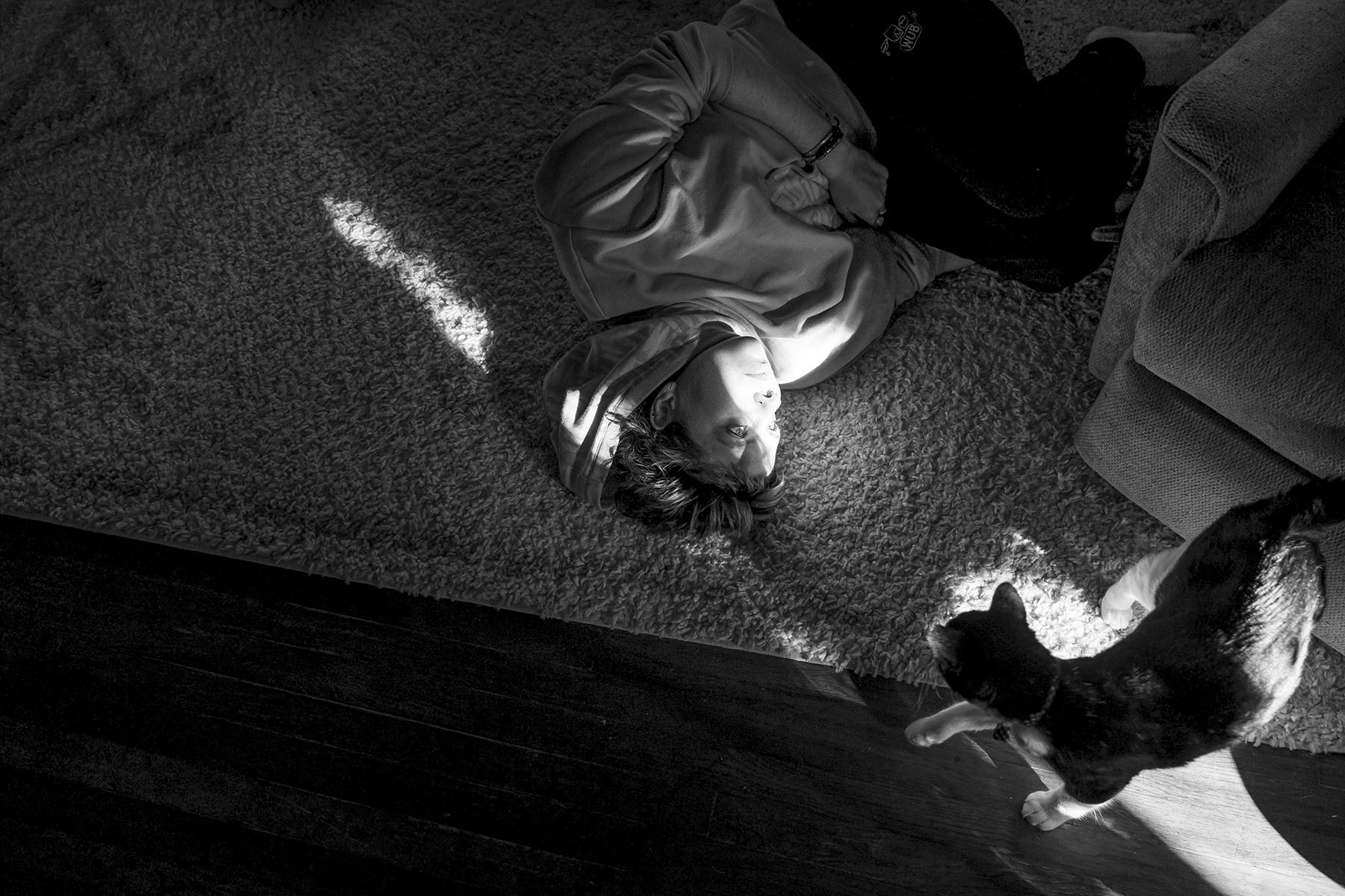 With their cat Tillett checking in on them, a shaft of light shines on Josie Norris’ face as they hang out at home on Oct. 30, 2022, in San Antonio, Texas. “My decision to have my fallopian tubes removed was not one I took lightly. When I was 21-years-old, I got pregnant when a condom broke with a casual hook-up right before Spring finals while at Central Michigan University. I spent final weeks of class obsessively googling what the odds of me being pregnant were and taking pregnancy tests. After the semester ended, I took the last pregnancy test I had. After peeing on a plastic stick, one of my biggest fears came true: I was pregnant and I wanted to be ‘unpregnant’ as soon as I could. I was about to move to Texas for a big internship and and began calling clinics looking for an appoitnment. I was able to be seen two hours away a few days later for a medical abortion. My experience was a lonely one— at the time of my abortion only one person knew I was pregnant— due to shame and the stigma of abortion I had witnessed growing up Evangelical Christian. The six months I spent in San Antonio was a healing and beautiful experience and when I returned to school, it was important to tell all my close femme friends what happened because what is mentionable is manageable. After my abortion, I knew I never wanted to be pregnant again. My surgery recontextualized the trauma of my abortion and my body will never betray me with a preganancy.”