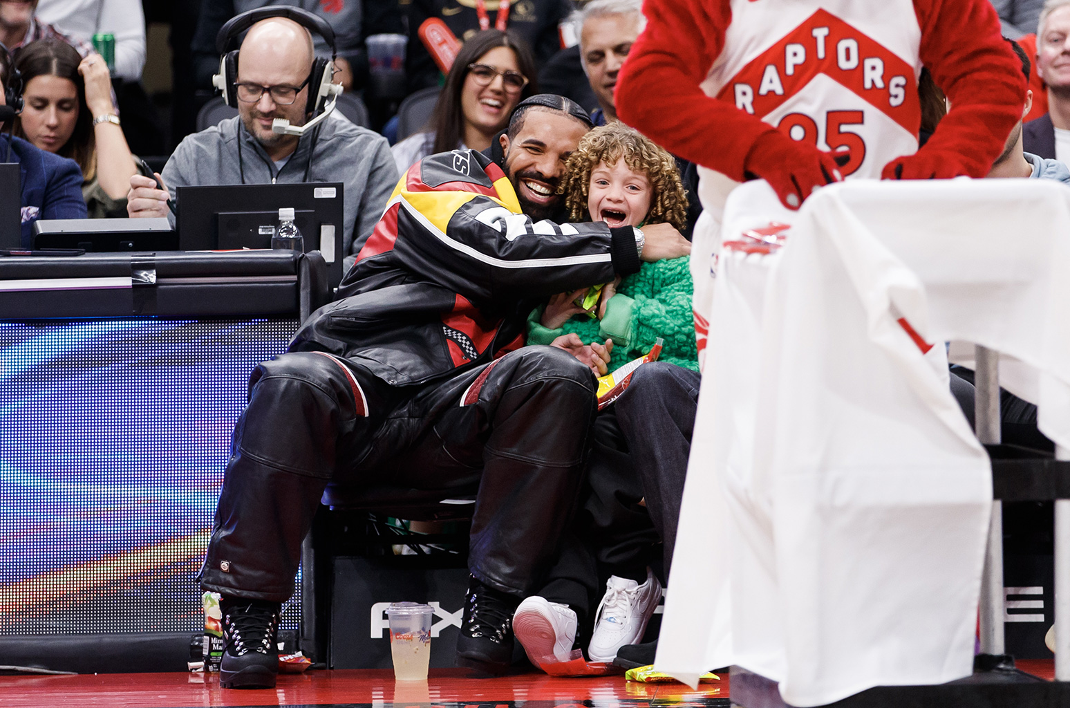 Drake & Son Adonis Sit Courtside at Toronto Raptors Basketball Game