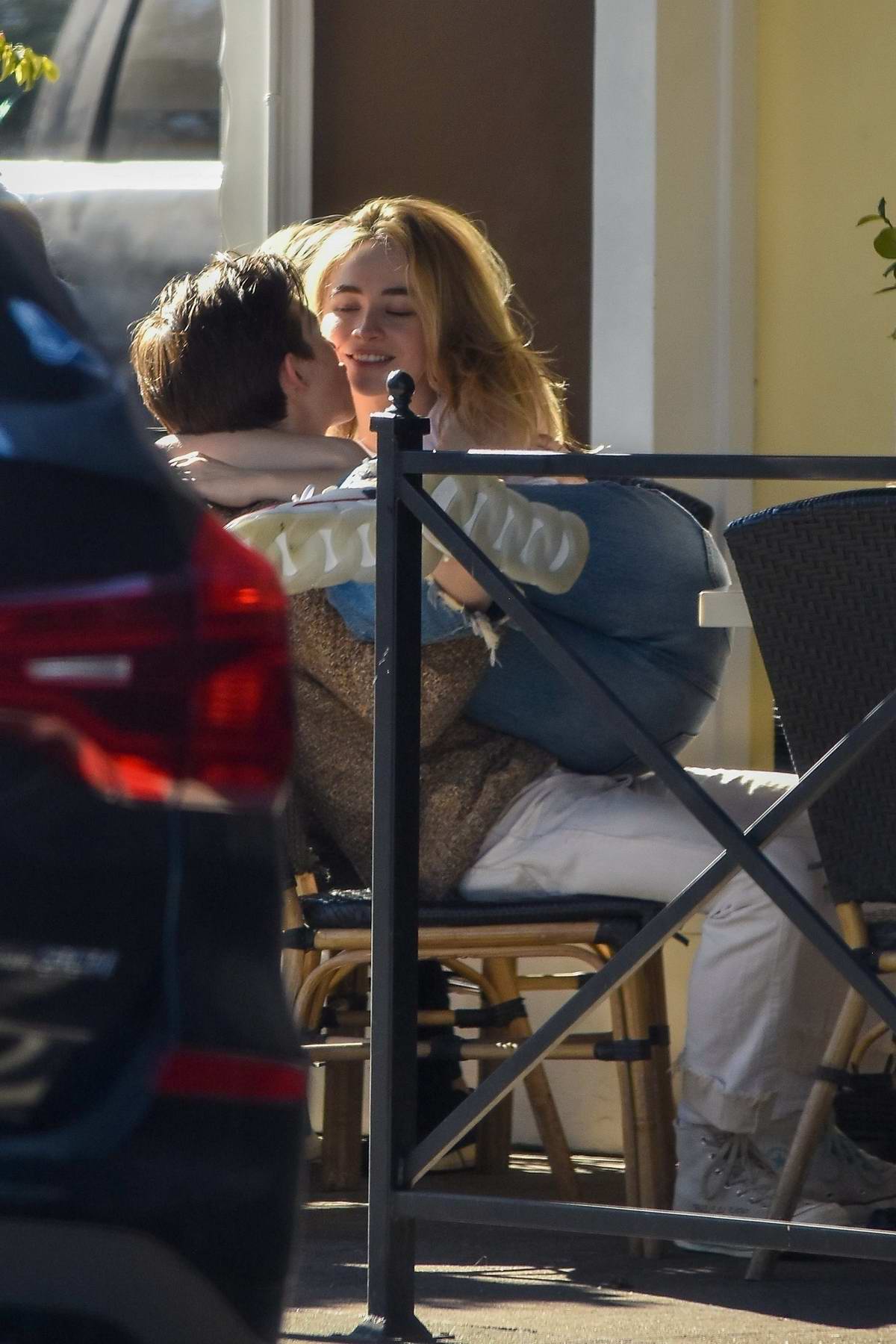 Sabrina Carpenter and Griffin Gluck pack on some PDA during their lunch