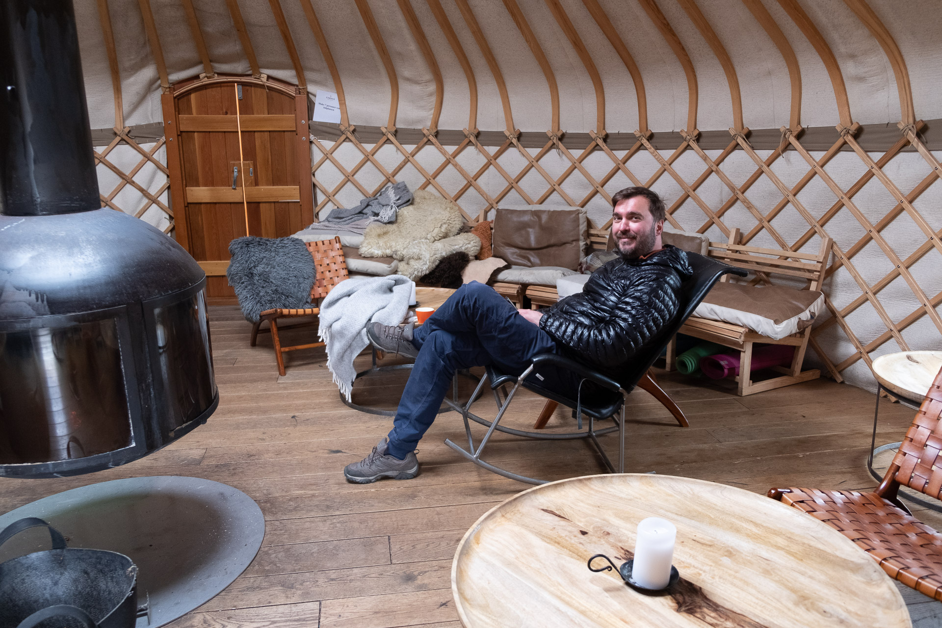 man relaxing in the common room at canvas telemark