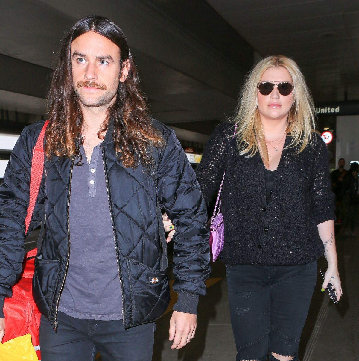 KESHA and Her Boyfriend Brad Ashenfelter at LAX Airport 12/21/2016