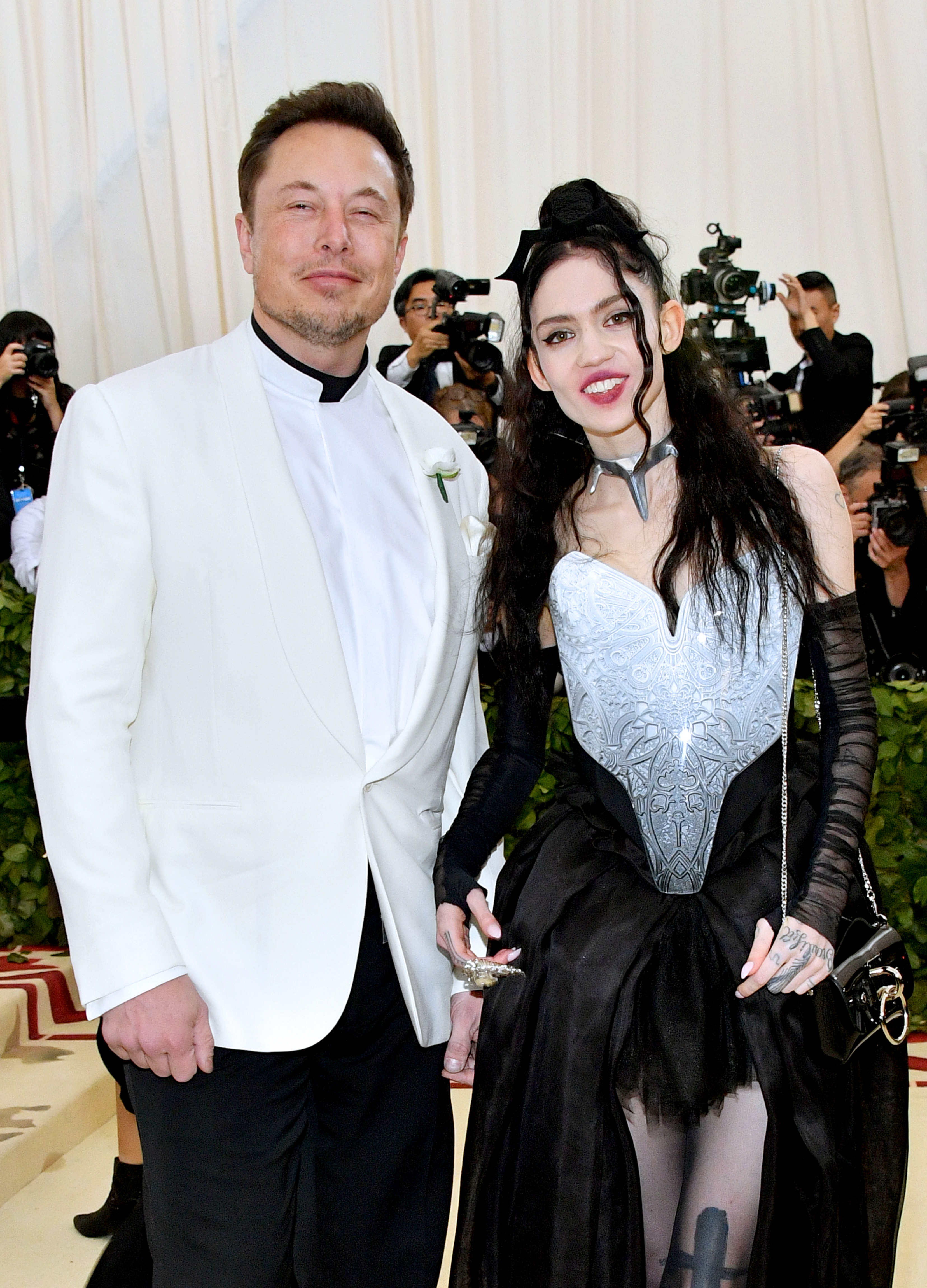 Elon Musk’s girlfriend Grimes confirms she’s pregnant with topless snap