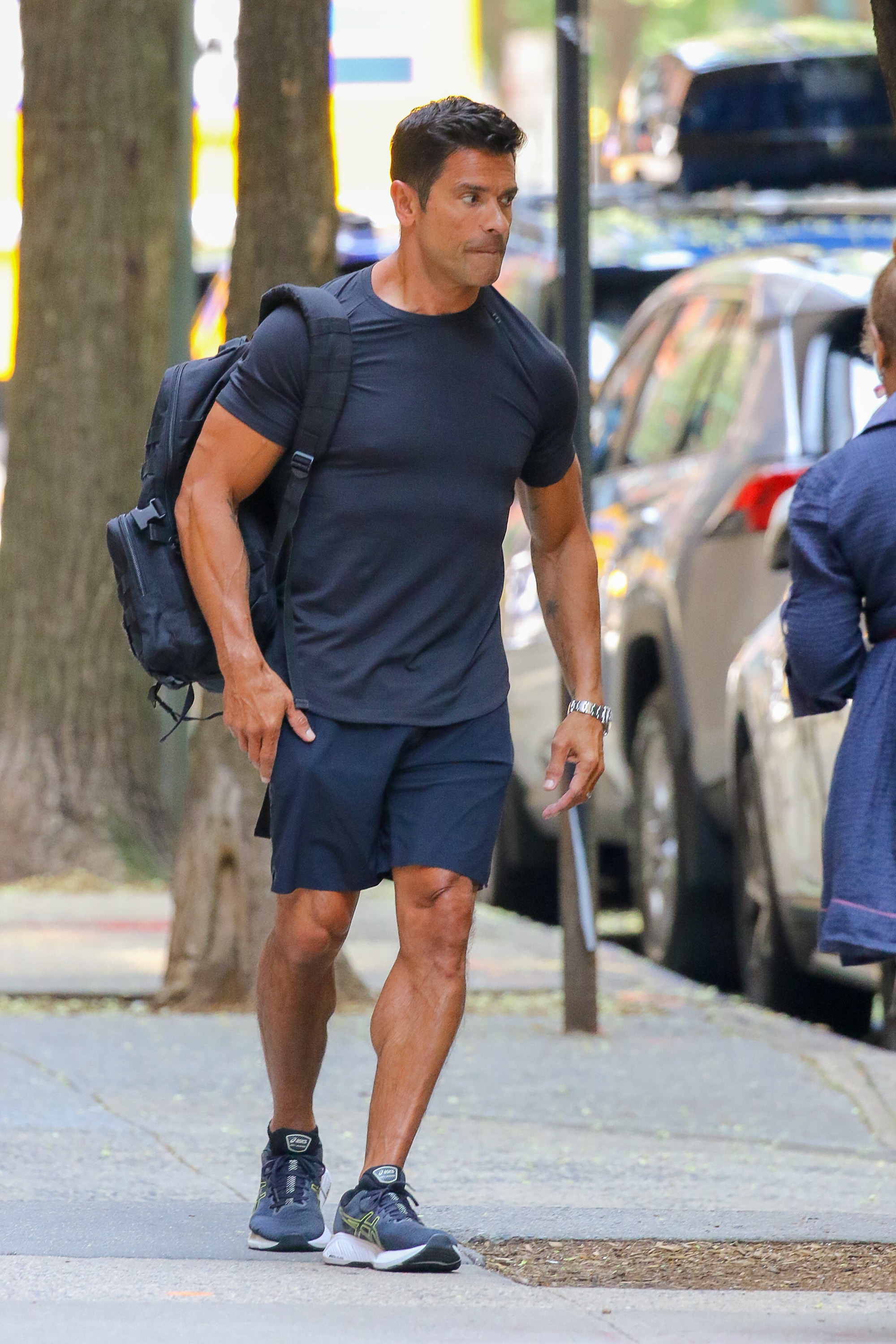 Live host Mark Consuelos shows off his massive muscles in tight gym