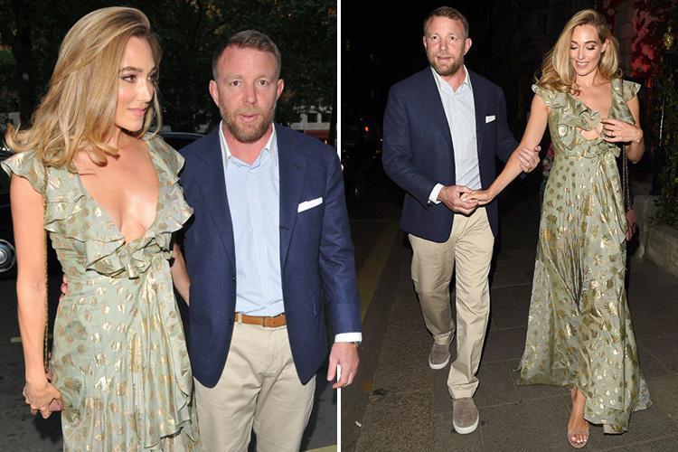 Guy Ritchie leads glamorous wife Jacqui Ainsley by the arm on night out