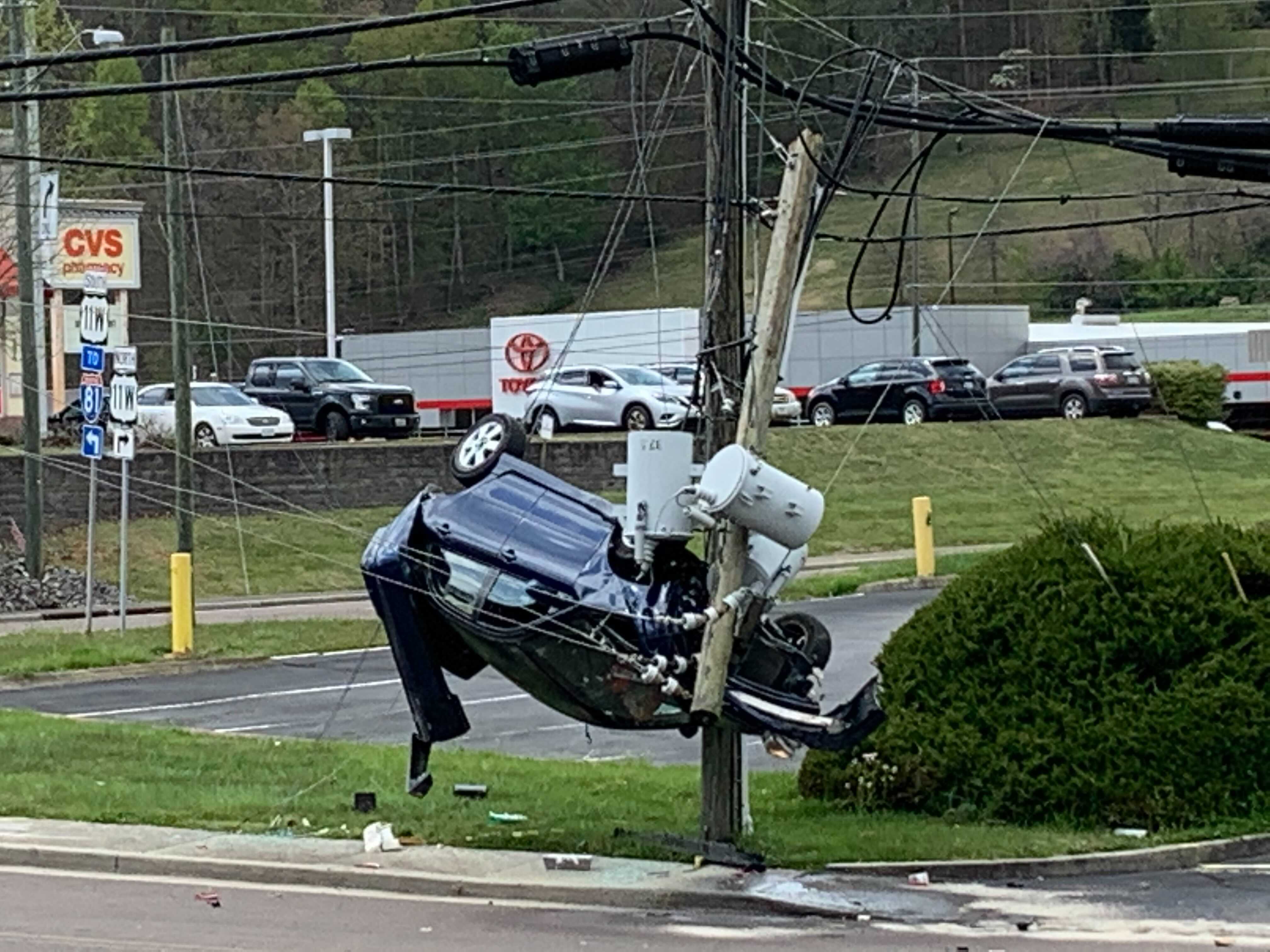 Crash leaves car suspended from utility wires in Bristol, driver facing